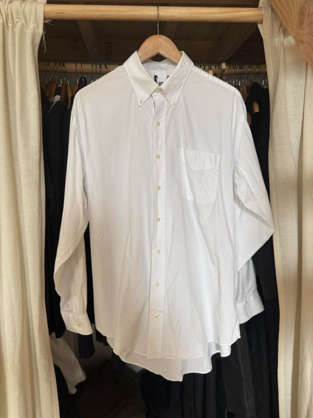 Classic white button-down shirt with a relaxed fit